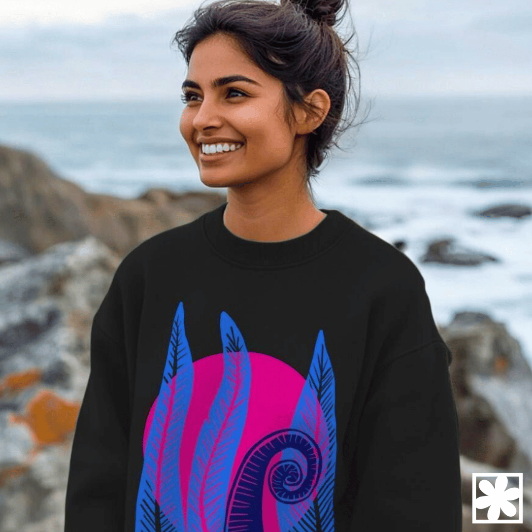A woman wears a statement sweatshirt with a bold and bright print on it